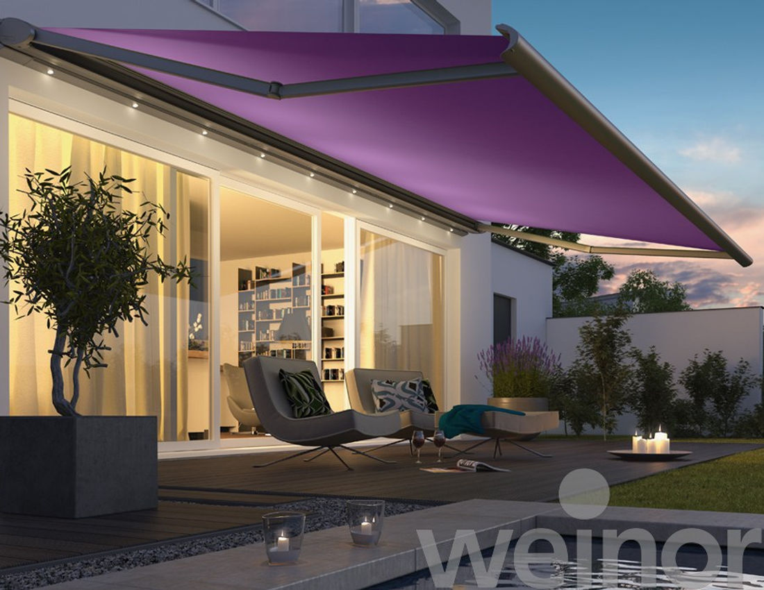 Purple retractable awning shading a modern home terrace